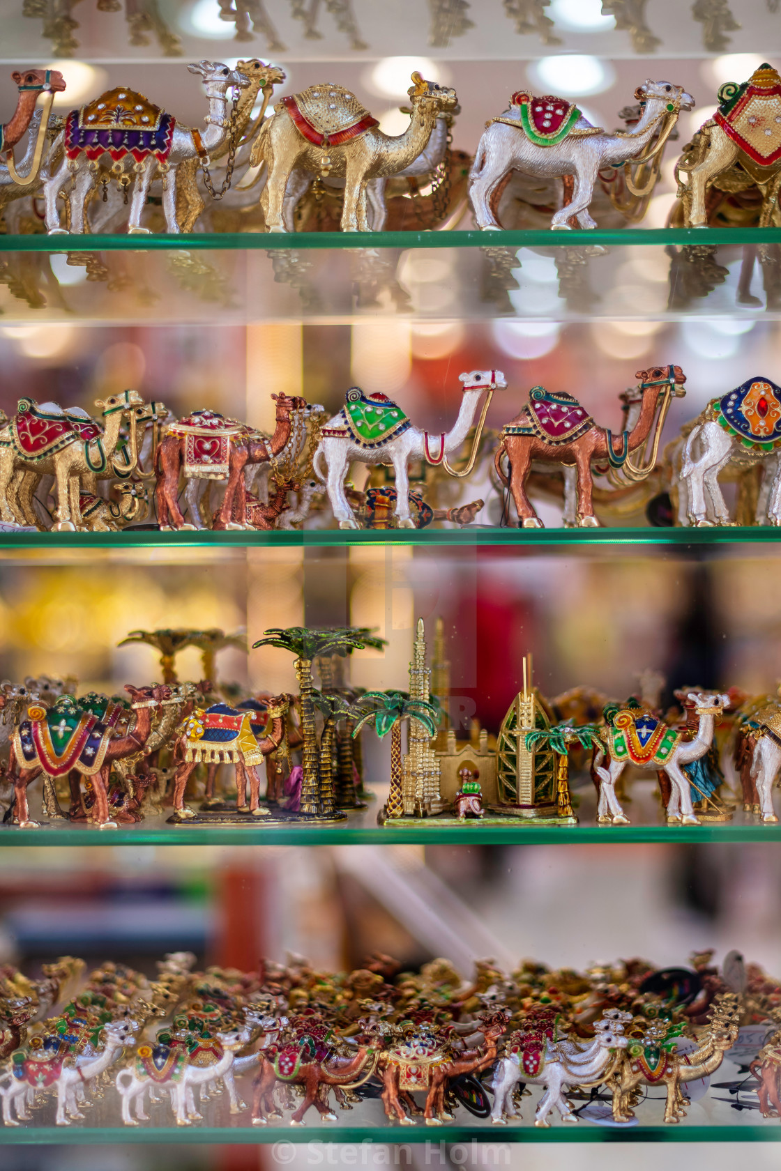 "Souveniers of miniature camels in brass at a window in the Deira" by Stefan Holm - $6.30 "Souveniers of miniature camels in brass at a window in the Deira" stock image