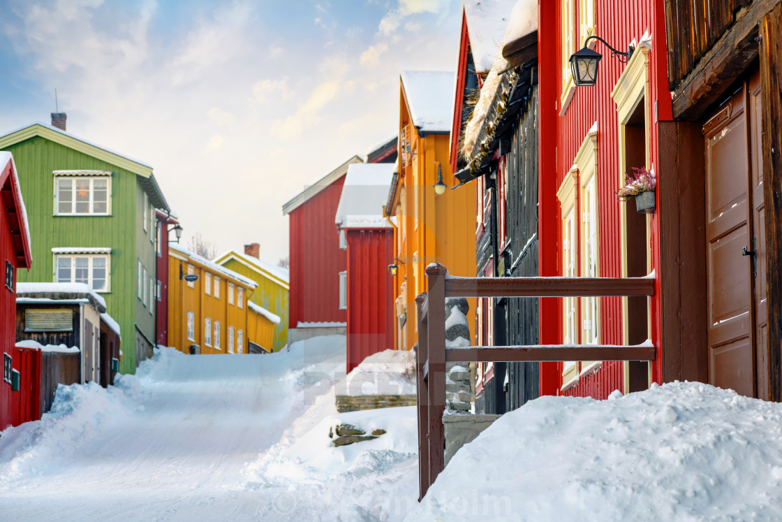 "Colorful building facades at a street covered in snow during win" by Stefan Holm - $6.31 "Colorful building facades at a street covered in snow during win" stock image