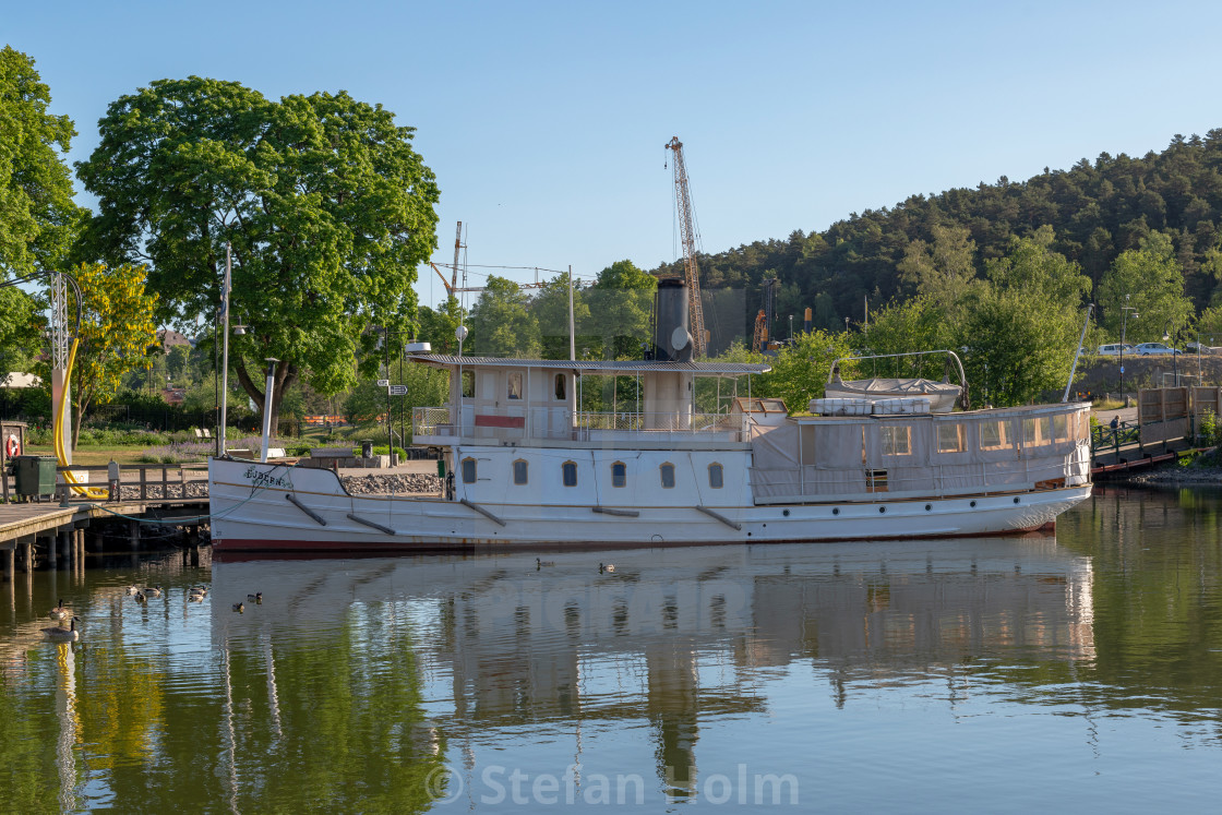 "Vintage steamboat EJDERN embarked at the park area in Sodertalje" by Stefan Holm - $6.29 "Vintage steamboat EJDERN embarked at the park area in Sodertalje" stock image