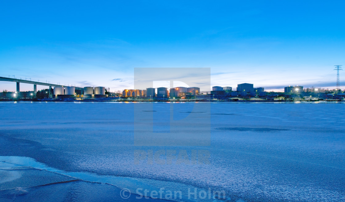 "Panoramic view of an oil supply site during winter at the shore" by Stefan Holm - $6.35 "Panoramic view of an oil supply site during winter at the shore" stock image