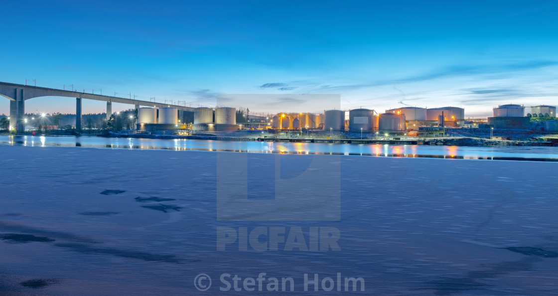 "Panoramic view of an oil supply site during winter at the shore" by Stefan Holm - $6.32 "Panoramic view of an oil supply site during winter at the shore" stock image