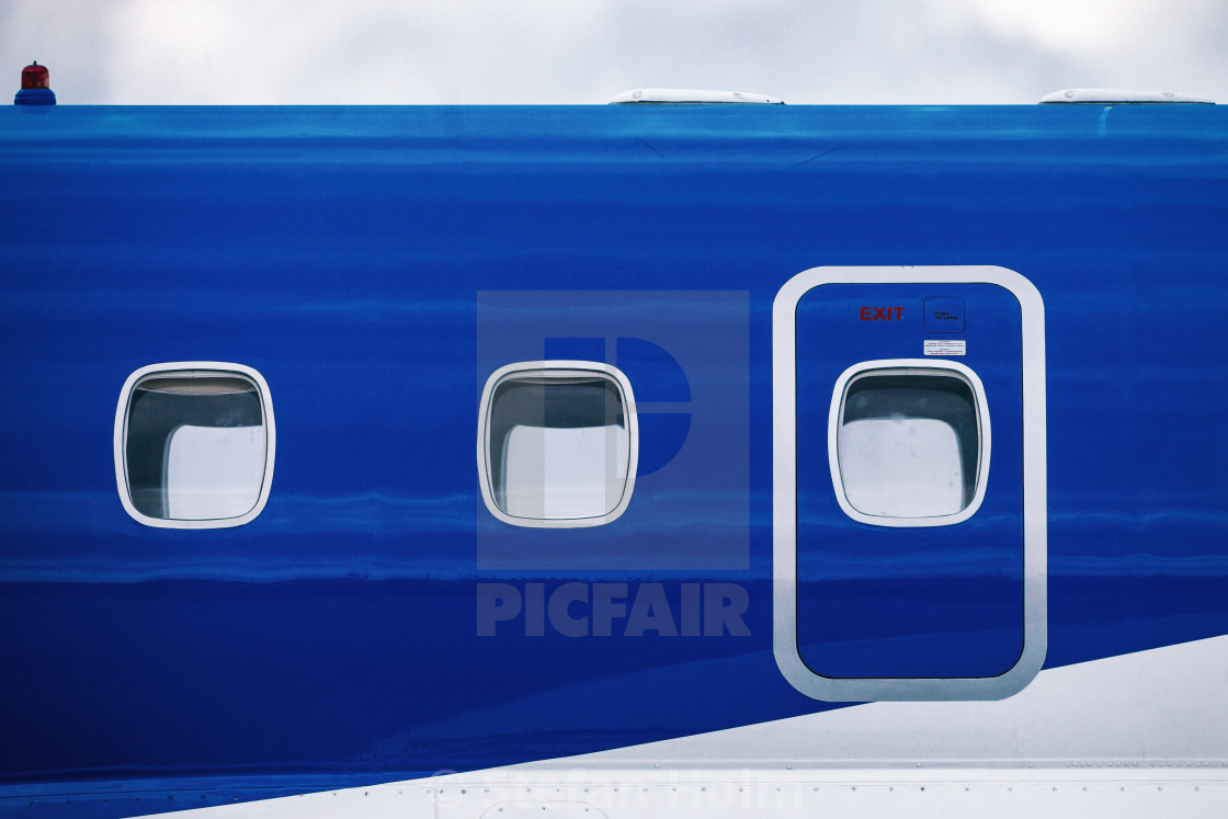 "Windows of a blue passenger plane in the airshow at Orebro airpo" by Stefan Holm - $6.32 "Windows of a blue passenger plane in the airshow at Orebro airpo" stock image