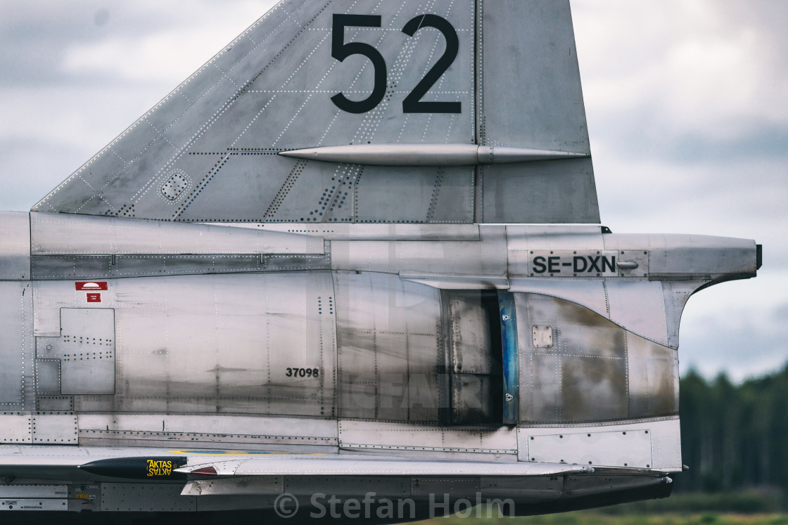 "Tail of AJS 37 Viggen in the airshow at Orebro airport" by Stefan Holm - $6.34 "Tail of AJS 37 Viggen in the airshow at Orebro airport" stock image