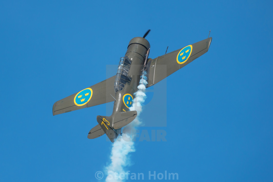 "Two SK 16 in a dogfight in the airshow at Orebro airport" by Stefan Holm - $6.30 "Two SK 16 in a dogfight in the airshow at Orebro airport" stock image