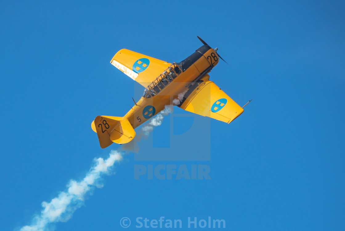 "Two SK 16 in a dogfight in the airshow at Orebro airport" by Stefan Holm - $6.30 "Two SK 16 in a dogfight in the airshow at Orebro airport" stock image