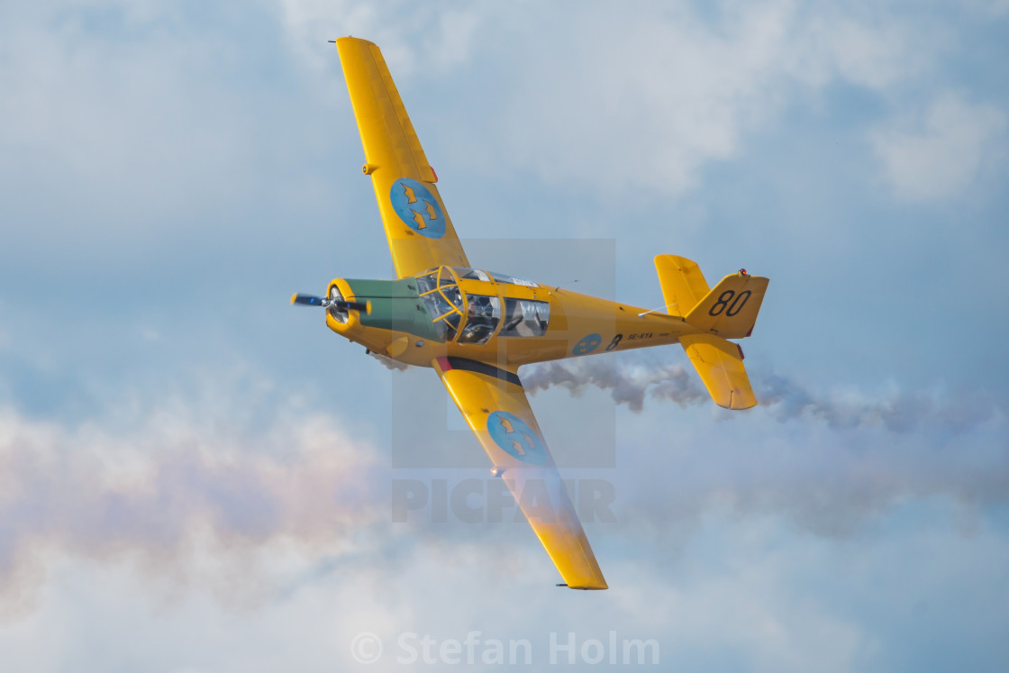 "Group of yellow SK 50 in formations in the airshow at Orebro air" by Stefan Holm - $6.35 "Group of yellow SK 50 in formations in the airshow at Orebro air" stock image