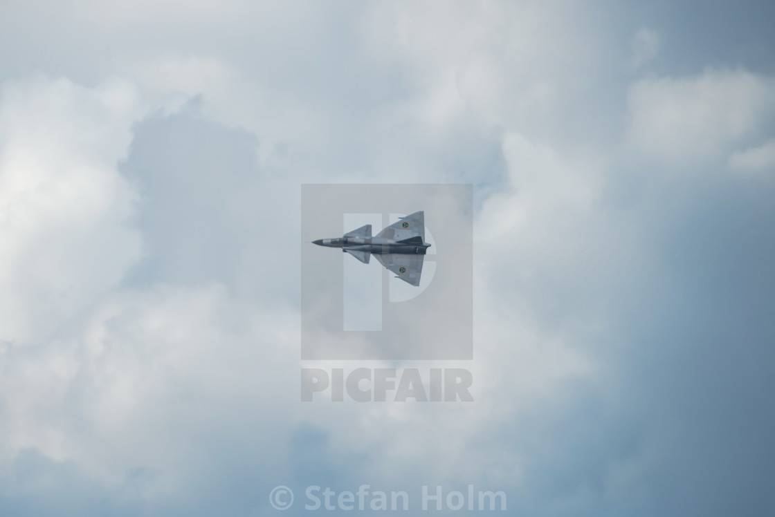 "AJS 37 Viggen in the airshow at Orebro airport" by Stefan Holm - $6.34 "AJS 37 Viggen in the airshow at Orebro airport" stock image