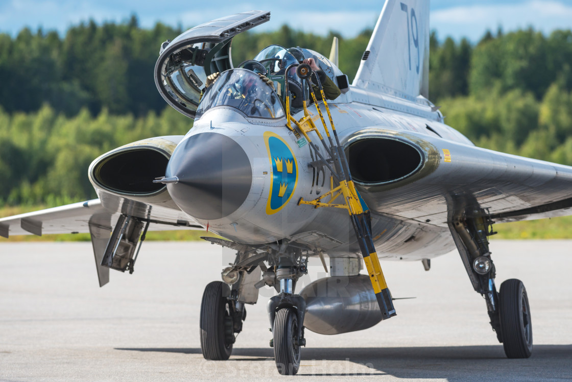 "SK 35 Draken in the airshow at Orebro airport" by Stefan Holm - $6.35 "SK 35 Draken in the airshow at Orebro airport" stock image