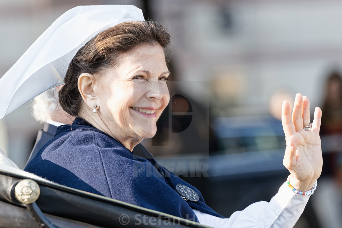 "Queen Silvia Bernadotte of Sweden waiving to audience on her way" by Stefan Holm - $6.31 "Queen Silvia Bernadotte of Sweden waiving to audience on her way" stock image