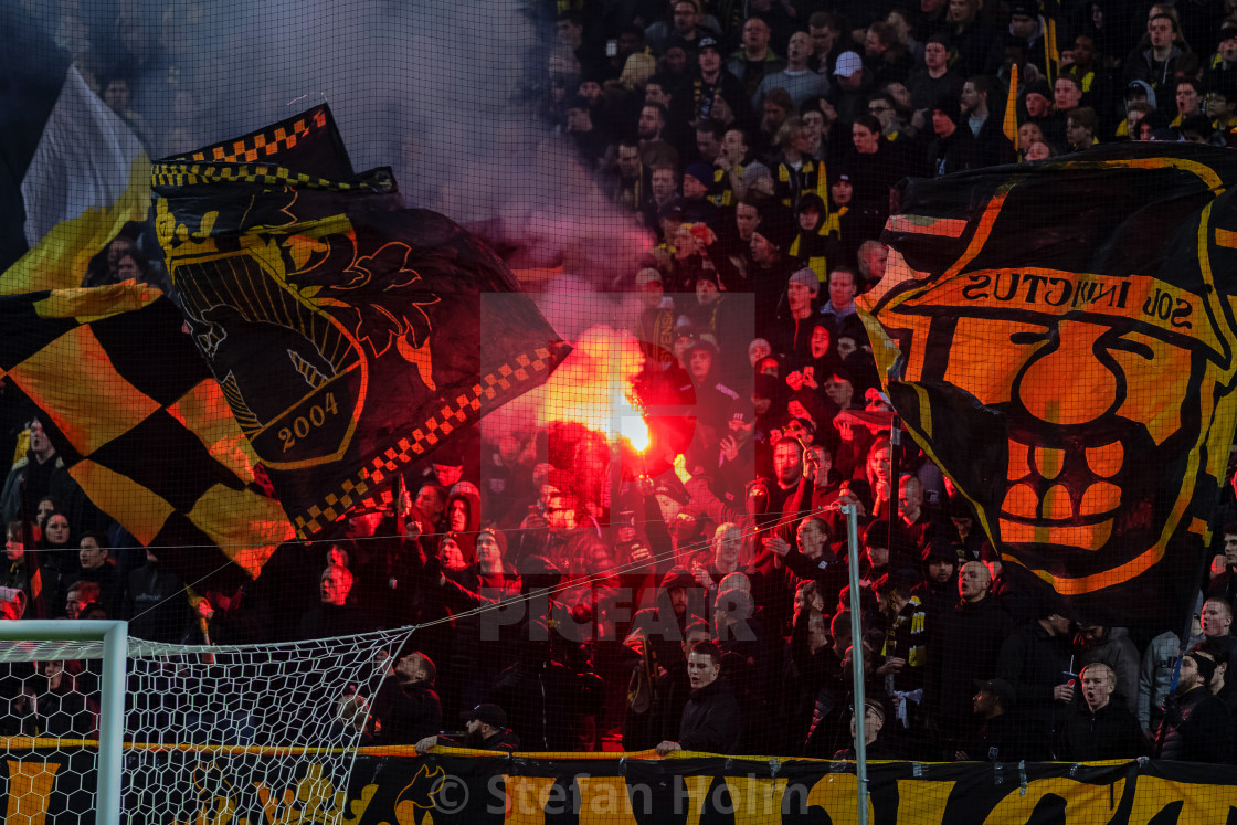 "SOLNA, SWEDEN, MARCH, 18, 2018: AIK tifo before the derby soccer game between AIK and Djurgarden in Svenska Cupen (Swedish Cup). Match delay due to smoke and low visibility 1hr." by Stefan Holm - $6.29 "SOLNA, SWEDEN, MARCH, 18, 2018: AIK tifo before the derby soccer game between AIK and Djurgarden in Svenska Cupen (Swedish Cup). Match delay due to smoke and low visibility 1hr." stock image