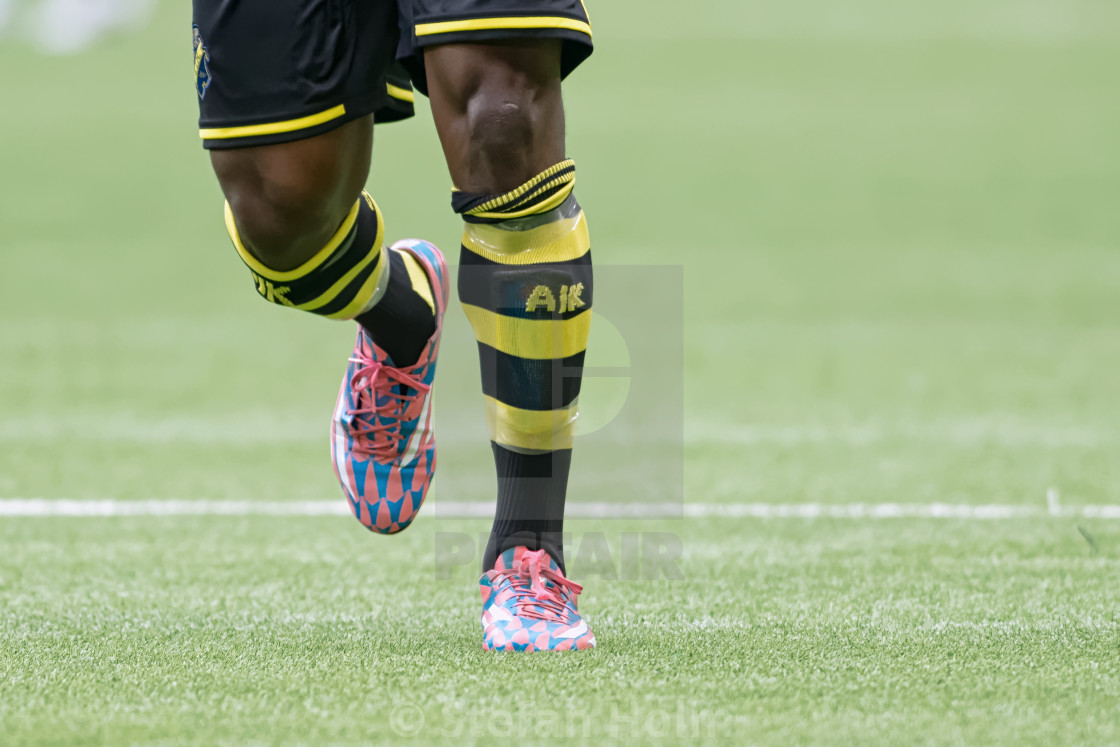"Close up of AIK player Banguras legs in the game of DIF against" by Stefan Holm - $6.32 "Close up of AIK player Banguras legs in the game of DIF against" stock image