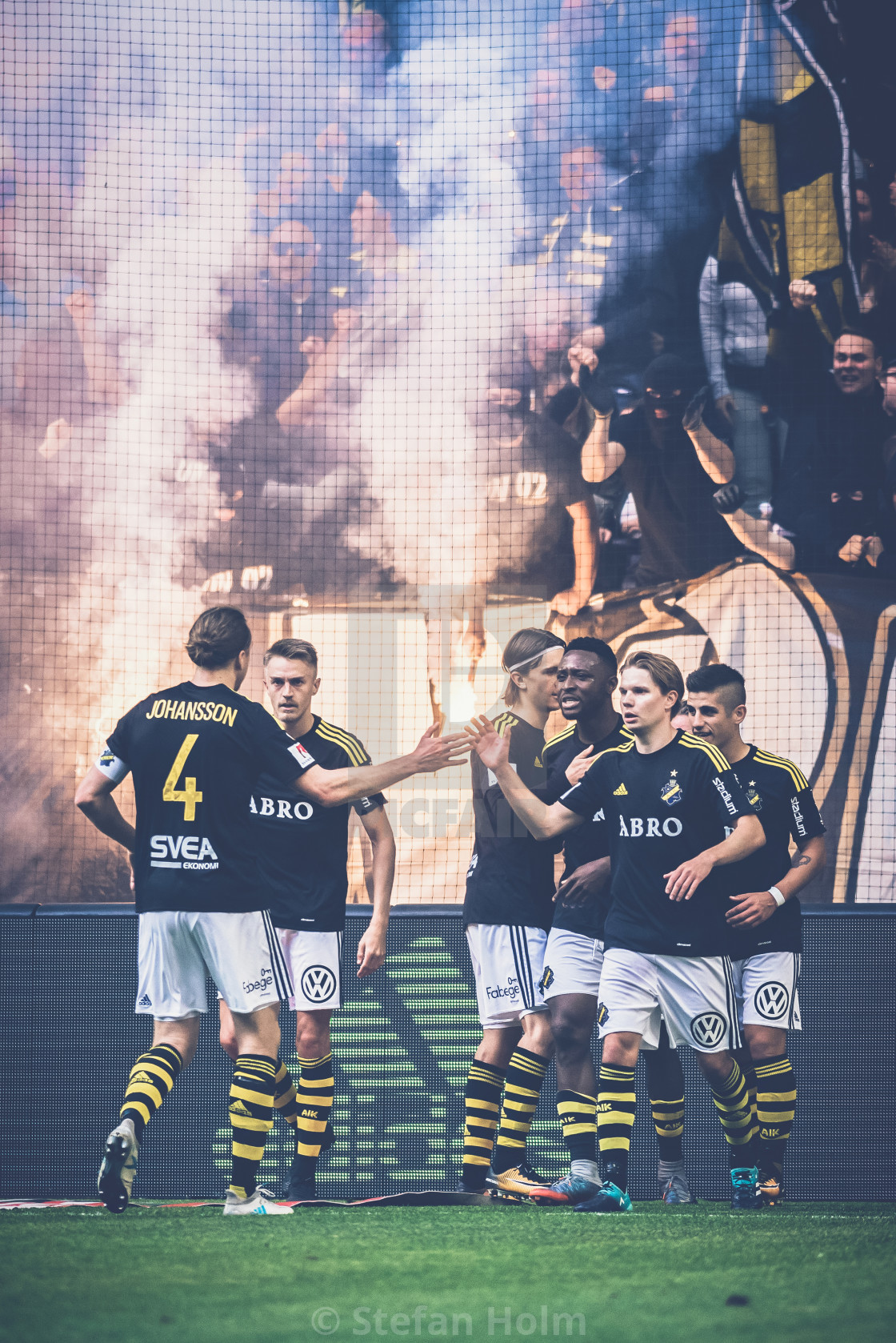 "AIK fans at the soccer derby between AIK and DIF in Allsvenskan" by Stefan Holm - $6.35 "AIK fans at the soccer derby between AIK and DIF in Allsvenskan" stock image