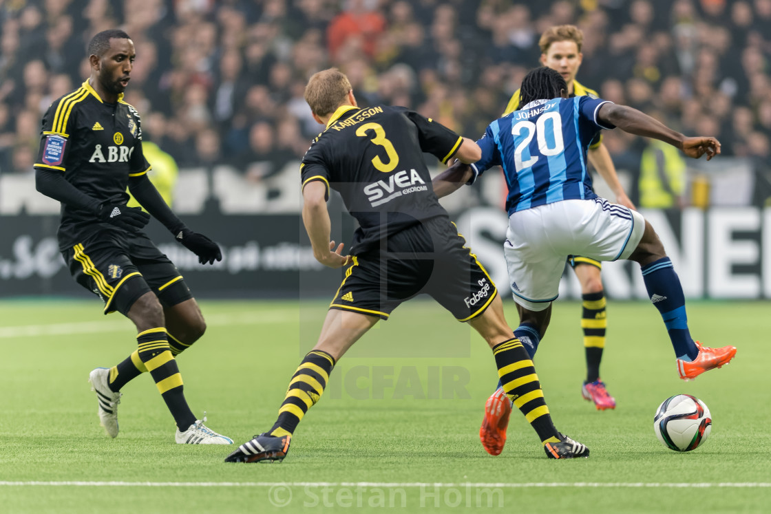 "Players fighting over the ball in the soccer game DIF vs AIK at" by Stefan Holm - $6.30 "Players fighting over the ball in the soccer game DIF vs AIK at" stock image