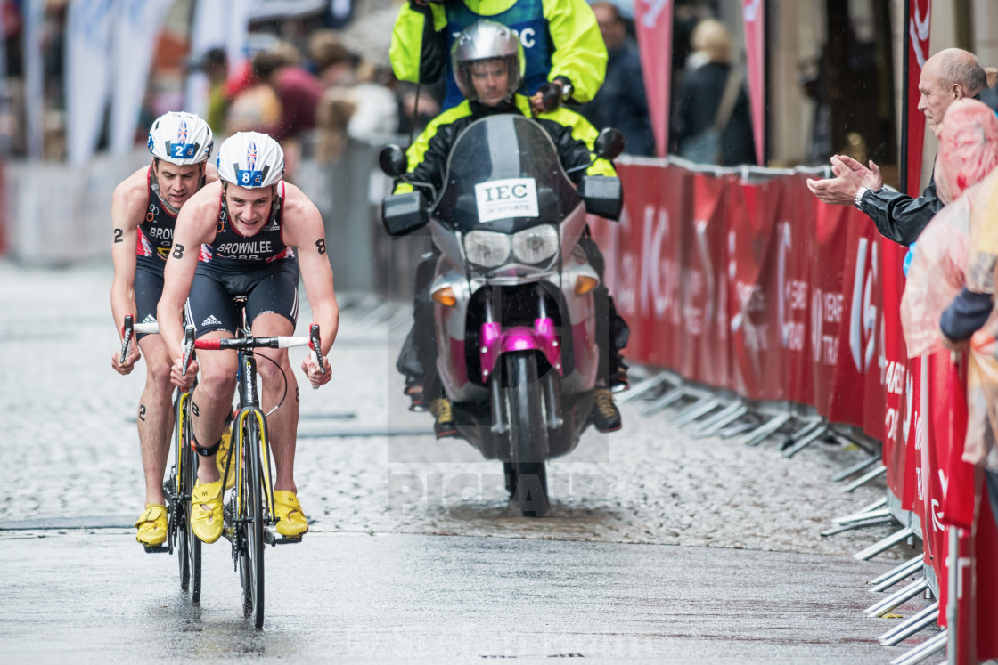 "Alistair Brownlee leading before his brother Jonathan on the wet" by Stefan Holm - $6.32 "Alistair Brownlee leading before his brother Jonathan on the wet" stock image
