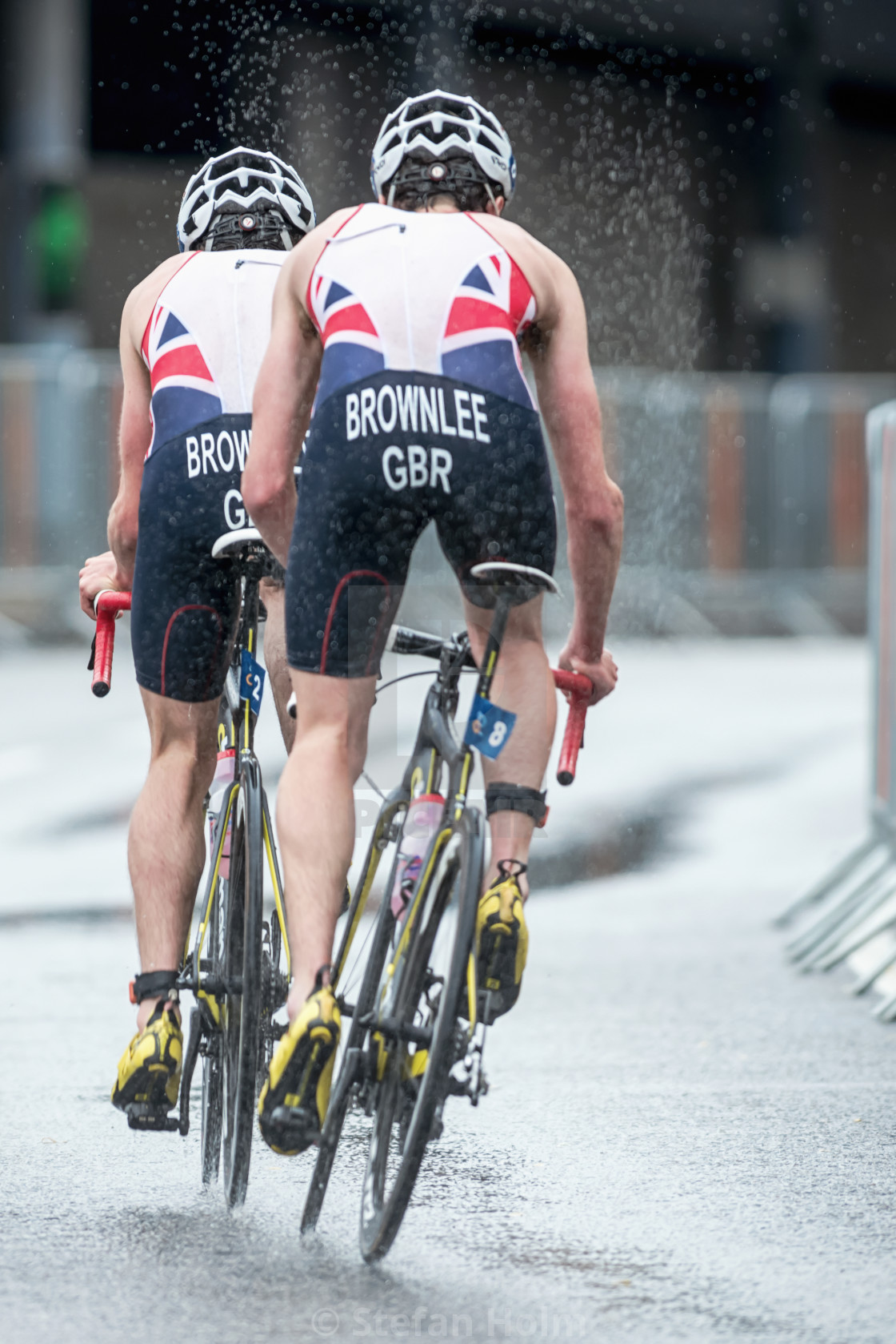 "Back of Brownlee brothers cycling in the heavy rain with water s" by Stefan Holm - $6.30 "Back of Brownlee brothers cycling in the heavy rain with water s" stock image