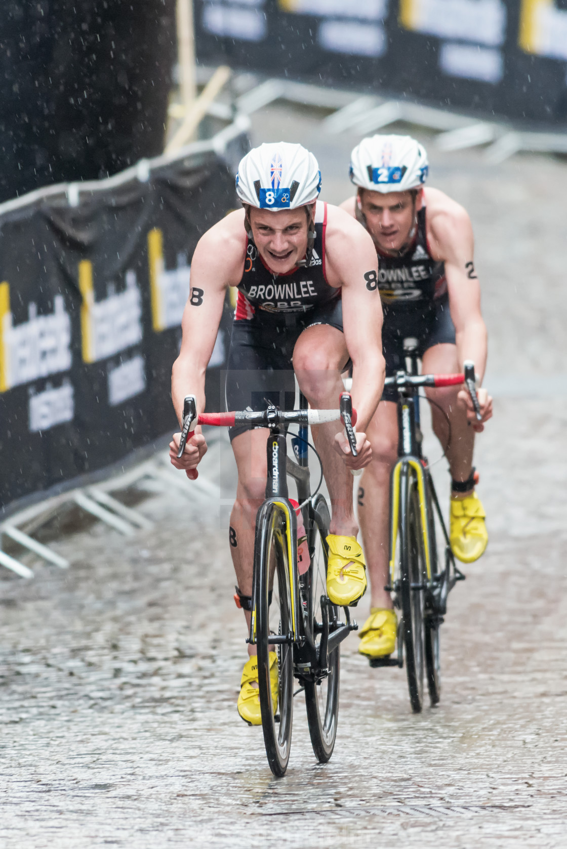"Triathlete Alistair Brownlee in front of his brother at the wet" by Stefan Holm - $6.29 "Triathlete Alistair Brownlee in front of his brother at the wet" stock image