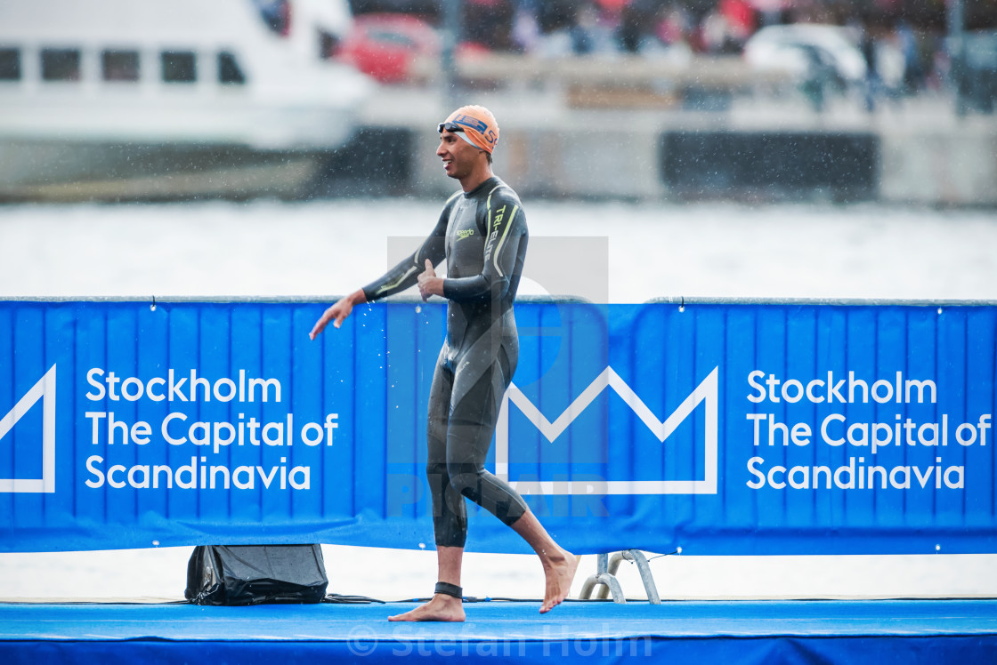 "Triathlete Riveros after warm up in heavy rain before the start" by Stefan Holm - $6.31 "Triathlete Riveros after warm up in heavy rain before the start" stock image