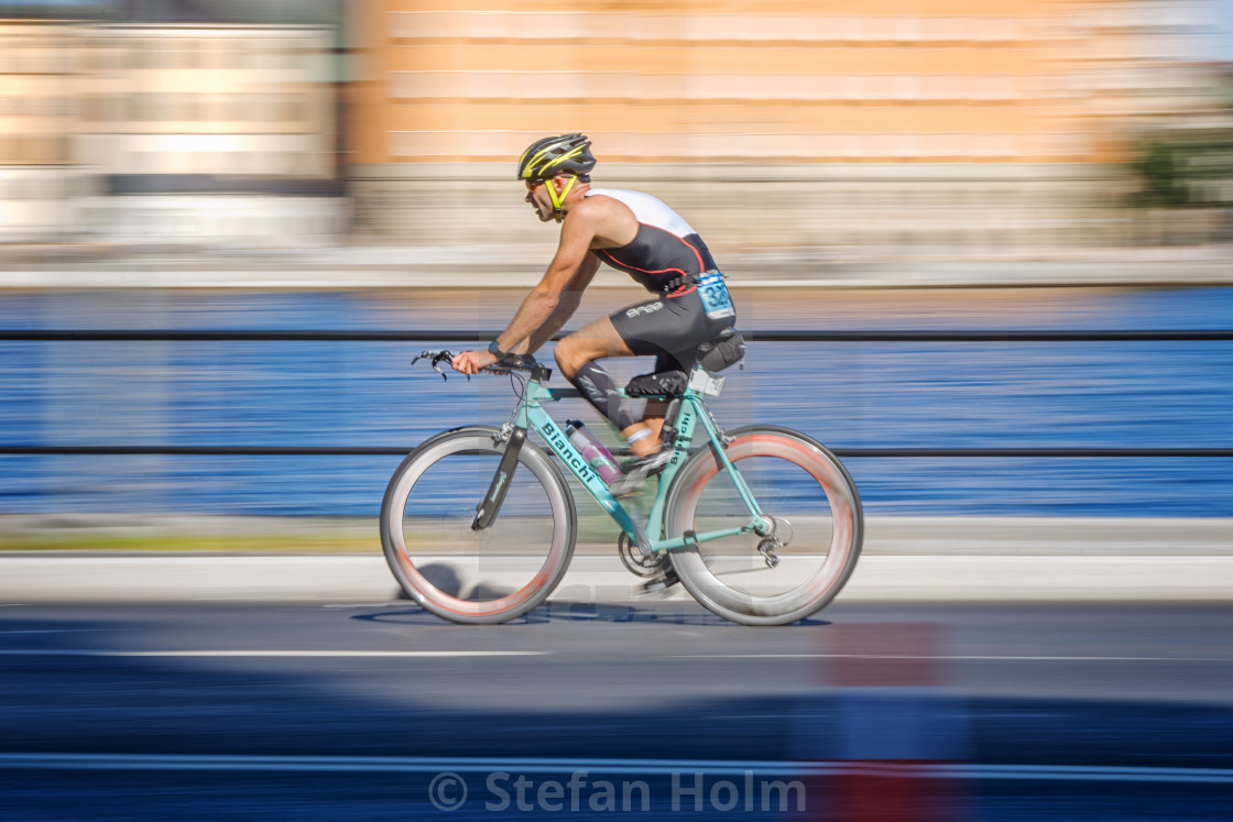 "Colorful triathlete cycling with motion blur of the panning at t" by Stefan Holm - $6.31 "Colorful triathlete cycling with motion blur of the panning at t" stock image