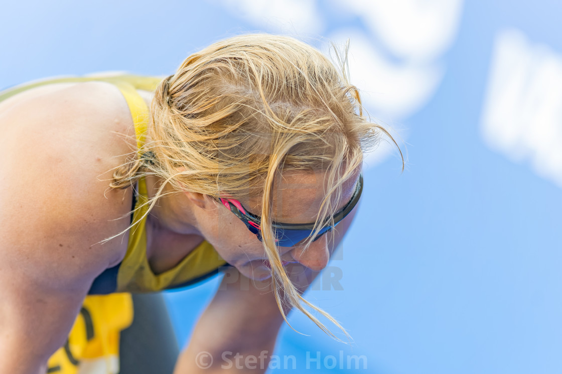 "Exhausted female triathlete at the finish area at the ITU World" by Stefan Holm - $6.32 "Exhausted female triathlete at the finish area at the ITU World" stock image