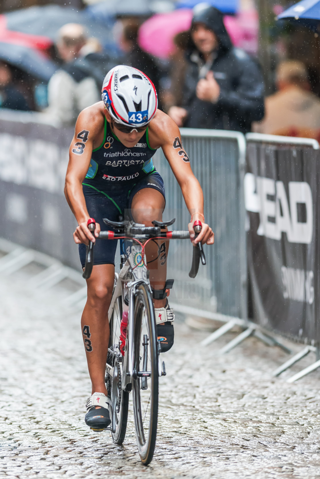 "Luisa Baptista from Brasil cycling in the rain at the Womans ITU" by Stefan Holm - $6.34 "Luisa Baptista from Brasil cycling in the rain at the Womans ITU" stock image