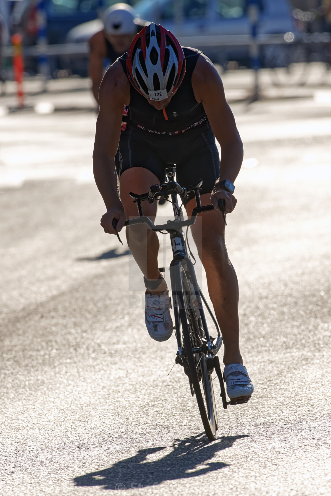 "Male triathlete cycling just after the transition area the ITU W" by Stefan Holm - $6.30 "Male triathlete cycling just after the transition area the ITU W" stock image