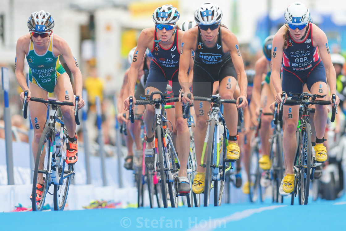 "Group of cyclists at the last lap before the transition between" by Stefan Holm - $6.31 "Group of cyclists at the last lap before the transition between" stock image