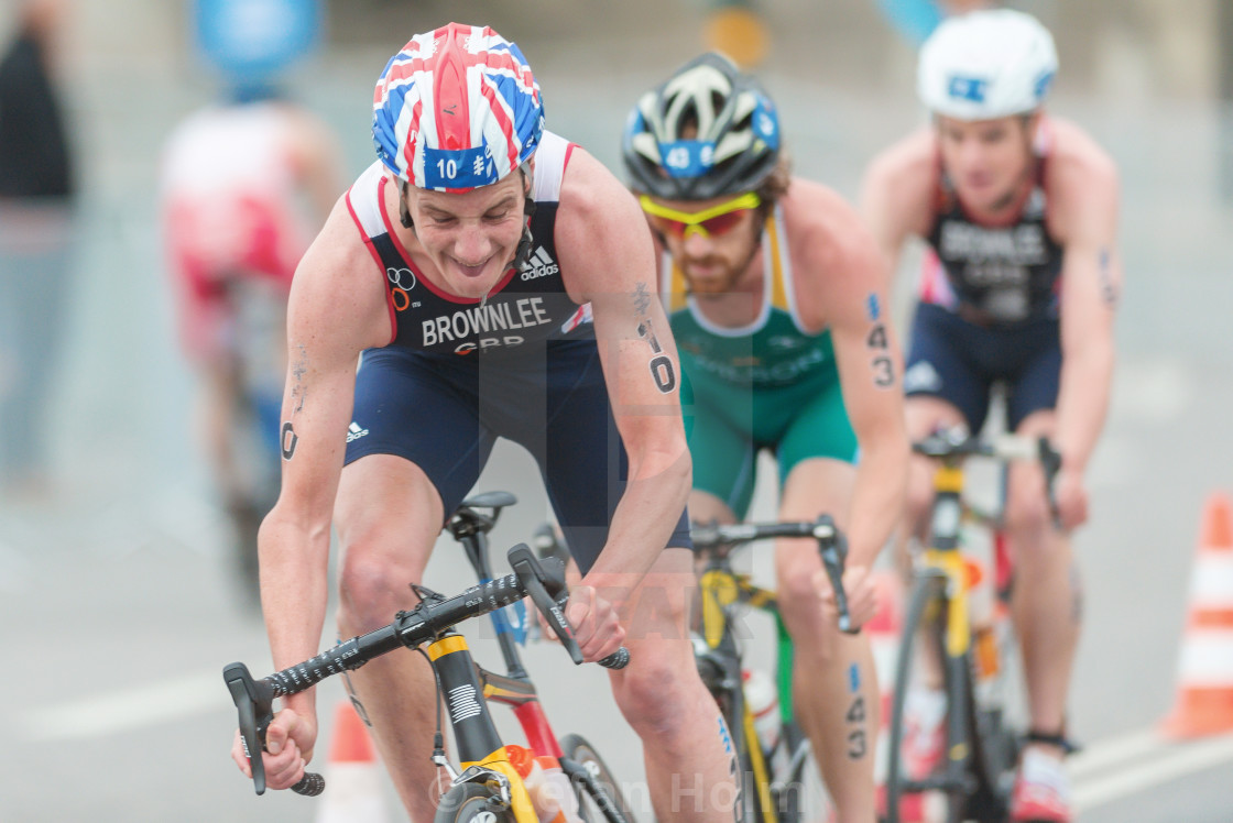 "Alistair Brownlee (GBR) in front of a group in the cycling at th" by Stefan Holm - $6.31 "Alistair Brownlee (GBR) in front of a group in the cycling at th" stock image