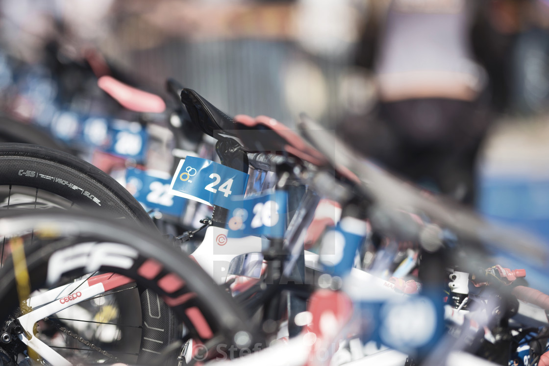"Bikes hanging in the transitiion area between the swimming and c" by Stefan Holm - $6.31 "Bikes hanging in the transitiion area between the swimming and c" stock image