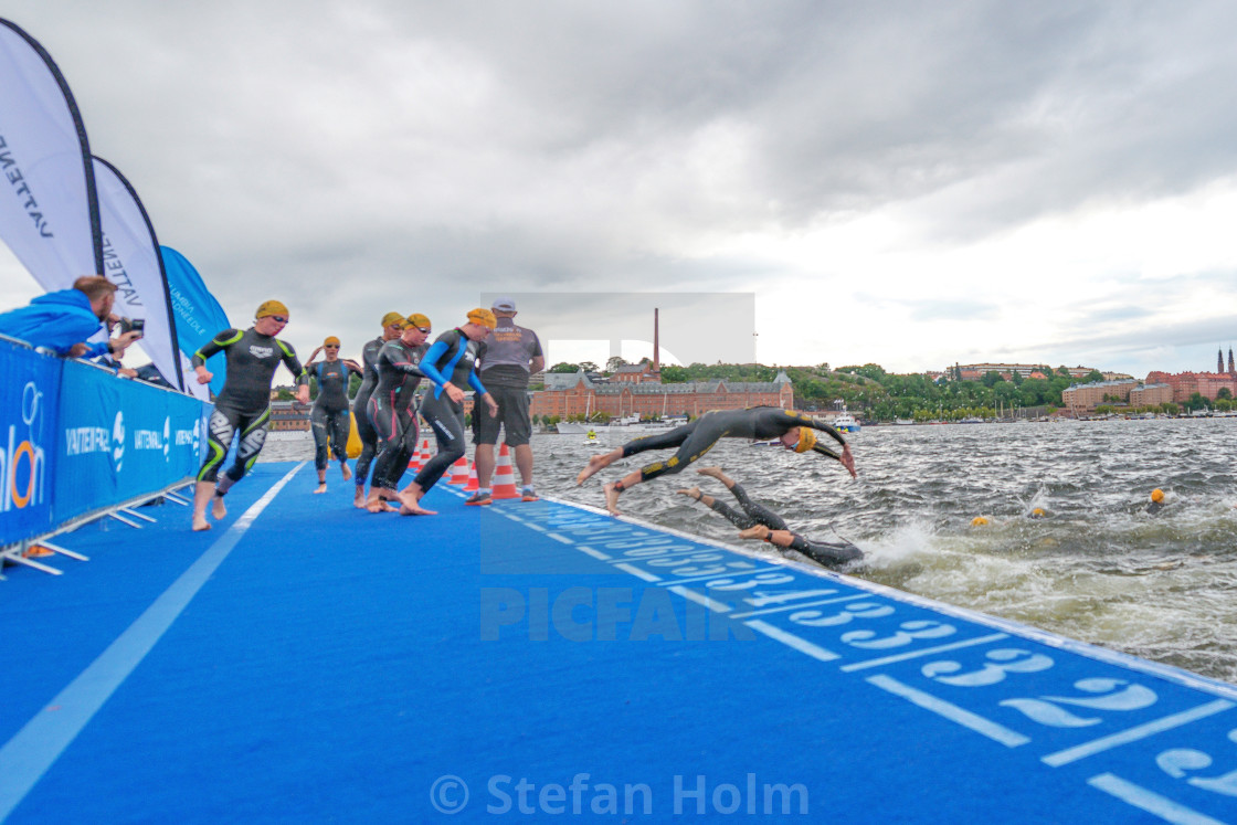 "Second lap at the swimming in the Women ITU Triathlon event in S" by Stefan Holm - $6.30 "Second lap at the swimming in the Women ITU Triathlon event in S" stock image