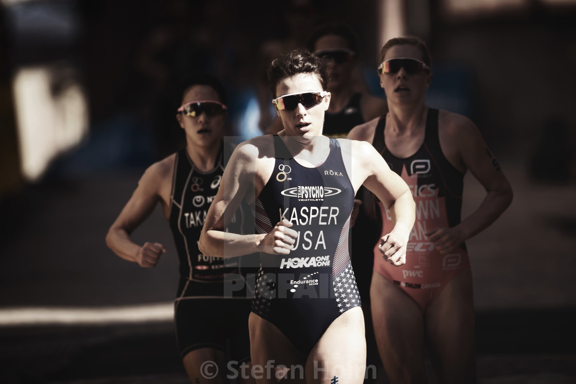"Group of female triathlete lead by Kirsten Kasper (USA) running" by Stefan Holm - $6.30 "Group of female triathlete lead by Kirsten Kasper (USA) running" stock image