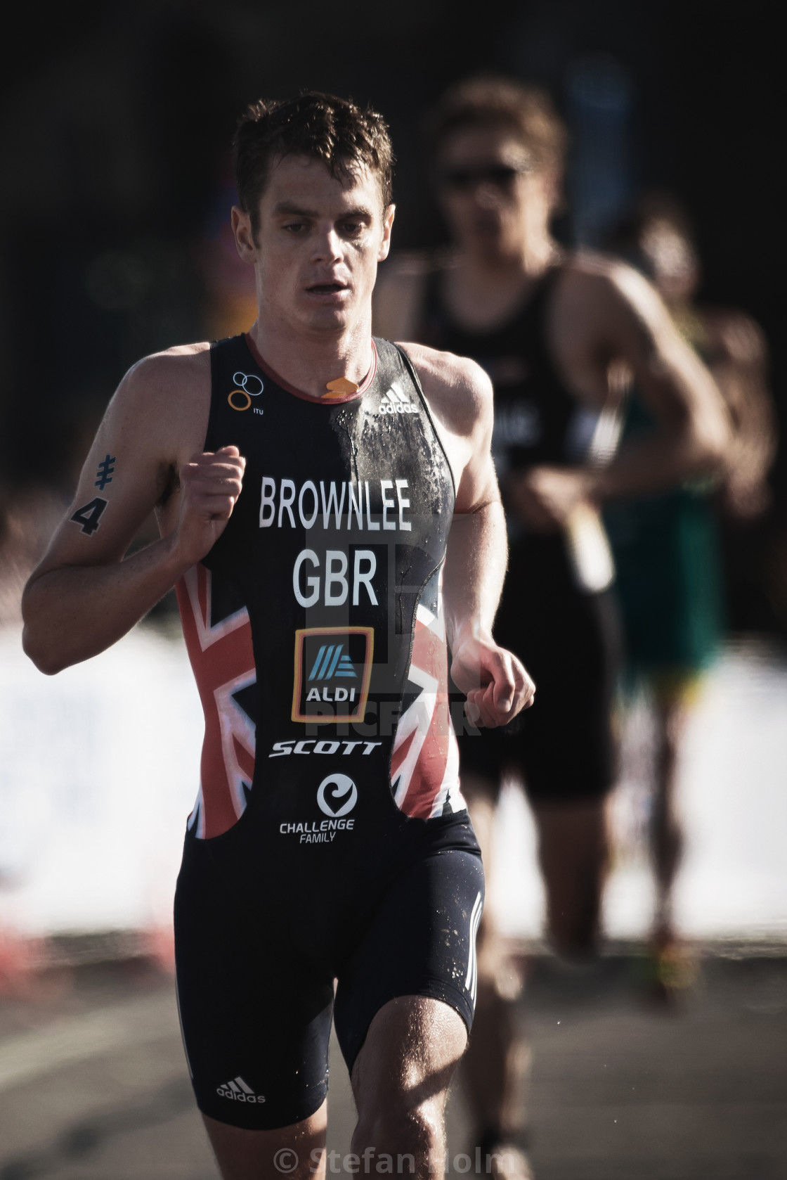 "Closeup of Jonathan Brownlee (GBR) running trough the streets of" by Stefan Holm - $6.35 "Closeup of Jonathan Brownlee (GBR) running trough the streets of" stock image
