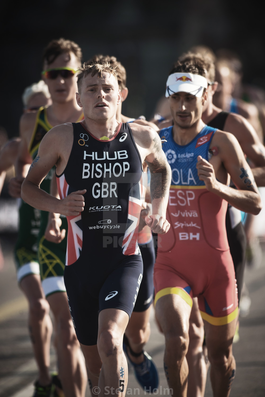 "Thomas Bishop (GBR) leading a group running trough the streets o" by Stefan Holm - $6.31 "Thomas Bishop (GBR) leading a group running trough the streets o" stock image