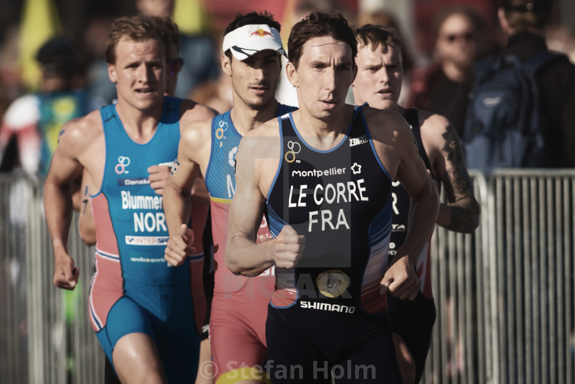 "Pierre Le Corre (FRA) leading a group running trough the streets" by Stefan Holm - $6.32 "Pierre Le Corre (FRA) leading a group running trough the streets" stock image