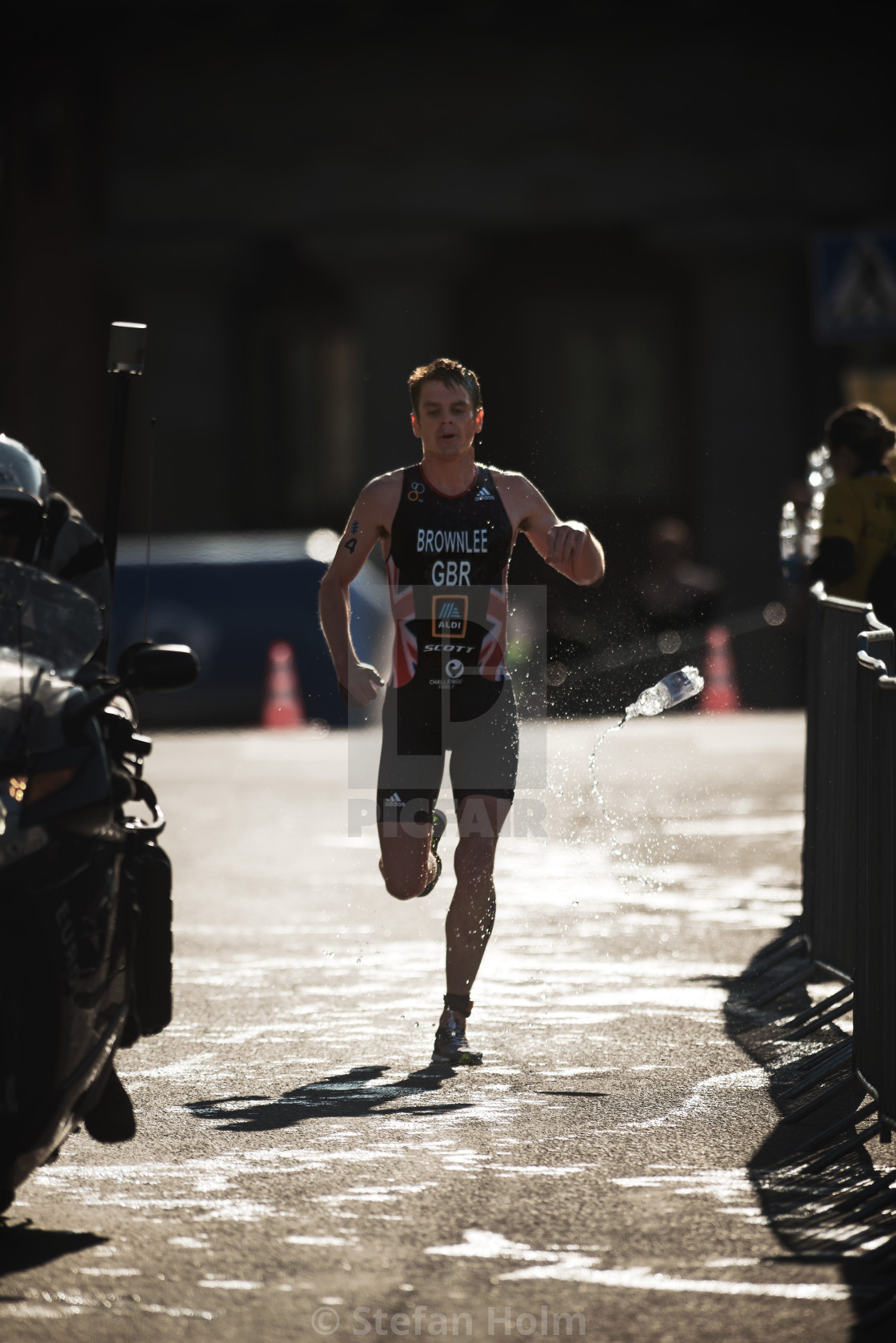 "Jonathan Brownlee (GBR) running trough the waterstation at the I" by Stefan Holm - $6.30 "Jonathan Brownlee (GBR) running trough the waterstation at the I" stock image
