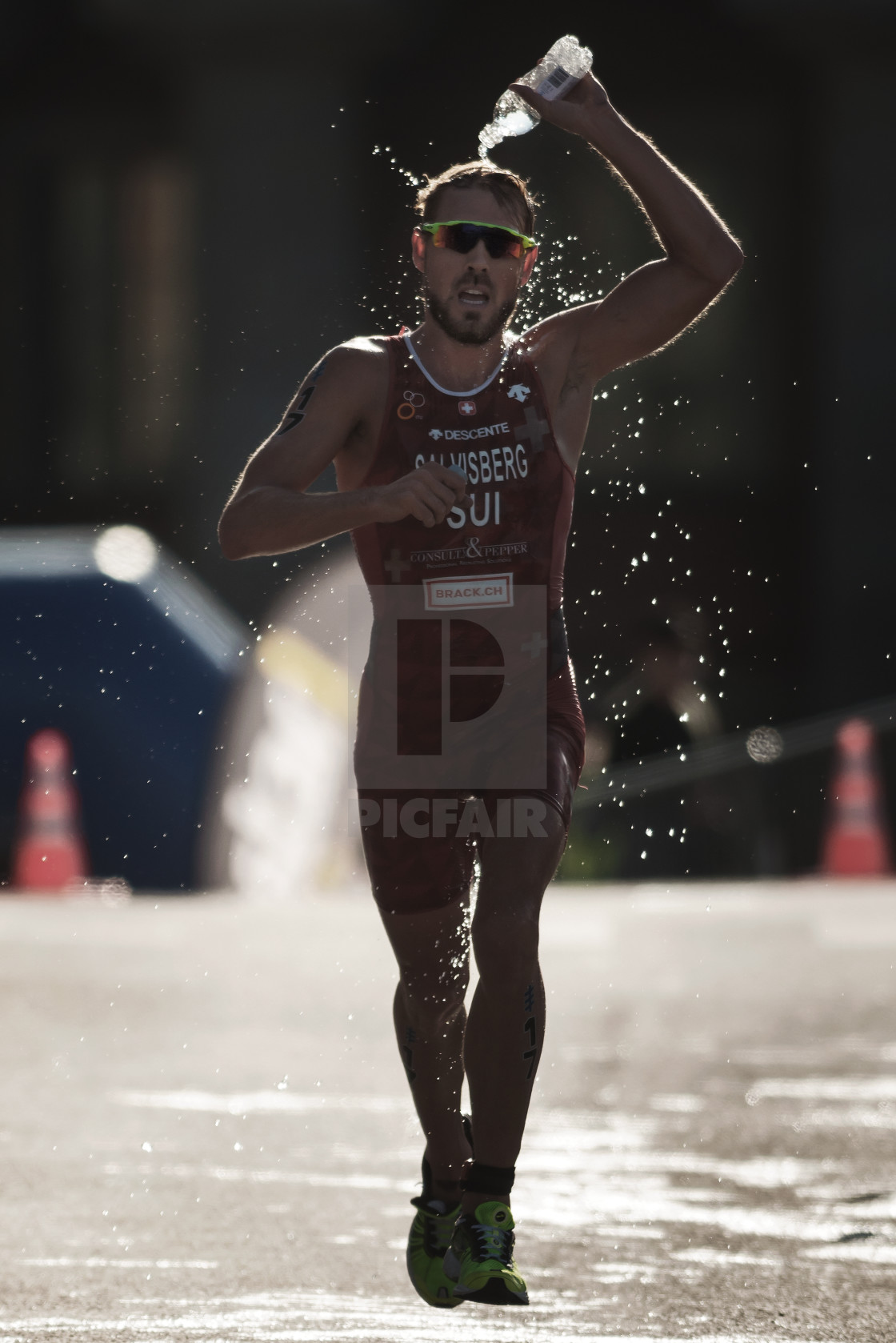 "Andrea Salvisberg (SUI) running trough the waterstation at the I" by Stefan Holm - $6.32 "Andrea Salvisberg (SUI) running trough the waterstation at the I" stock image