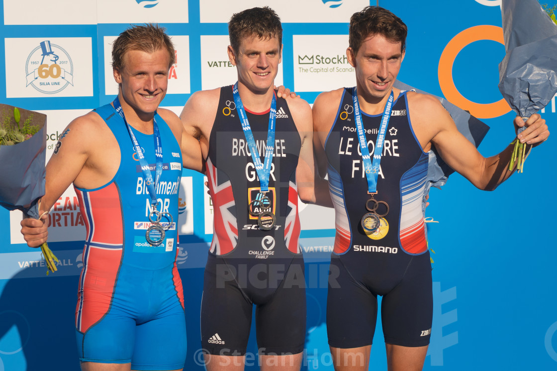 "Winner Jonathan Brownlee (GBR) with Blummenfelt (NOR) second and" by Stefan Holm - $6.29 "Winner Jonathan Brownlee (GBR) with Blummenfelt (NOR) second and" stock image