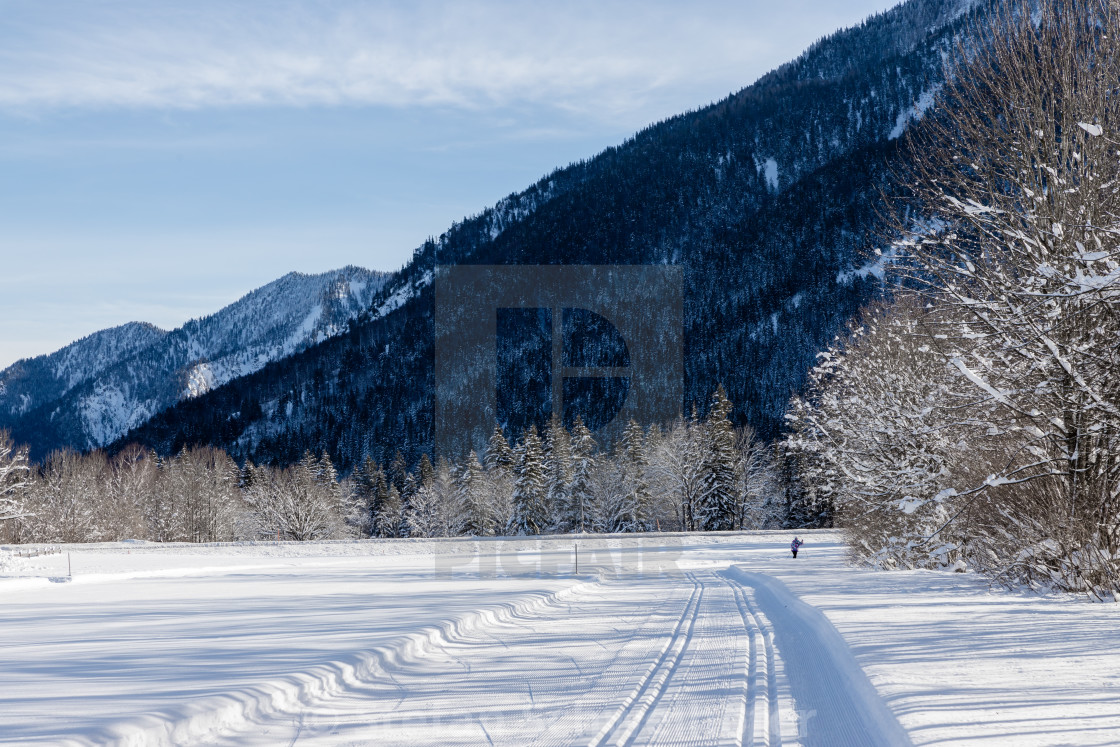 "Cross-country ski trail with mountains" by Stefan Schweihofer - $12.57 "Cross-country ski trail with mountains" stock image