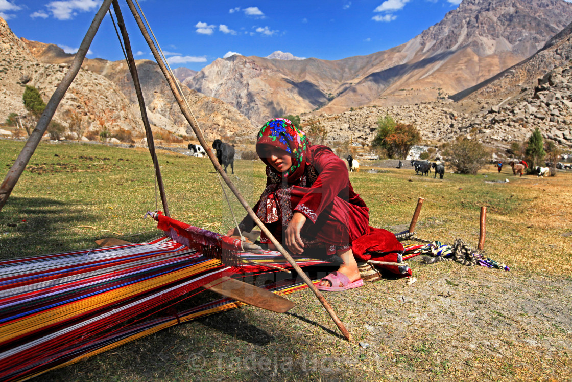 "Girl weaving wool in Fann mountains" stock image