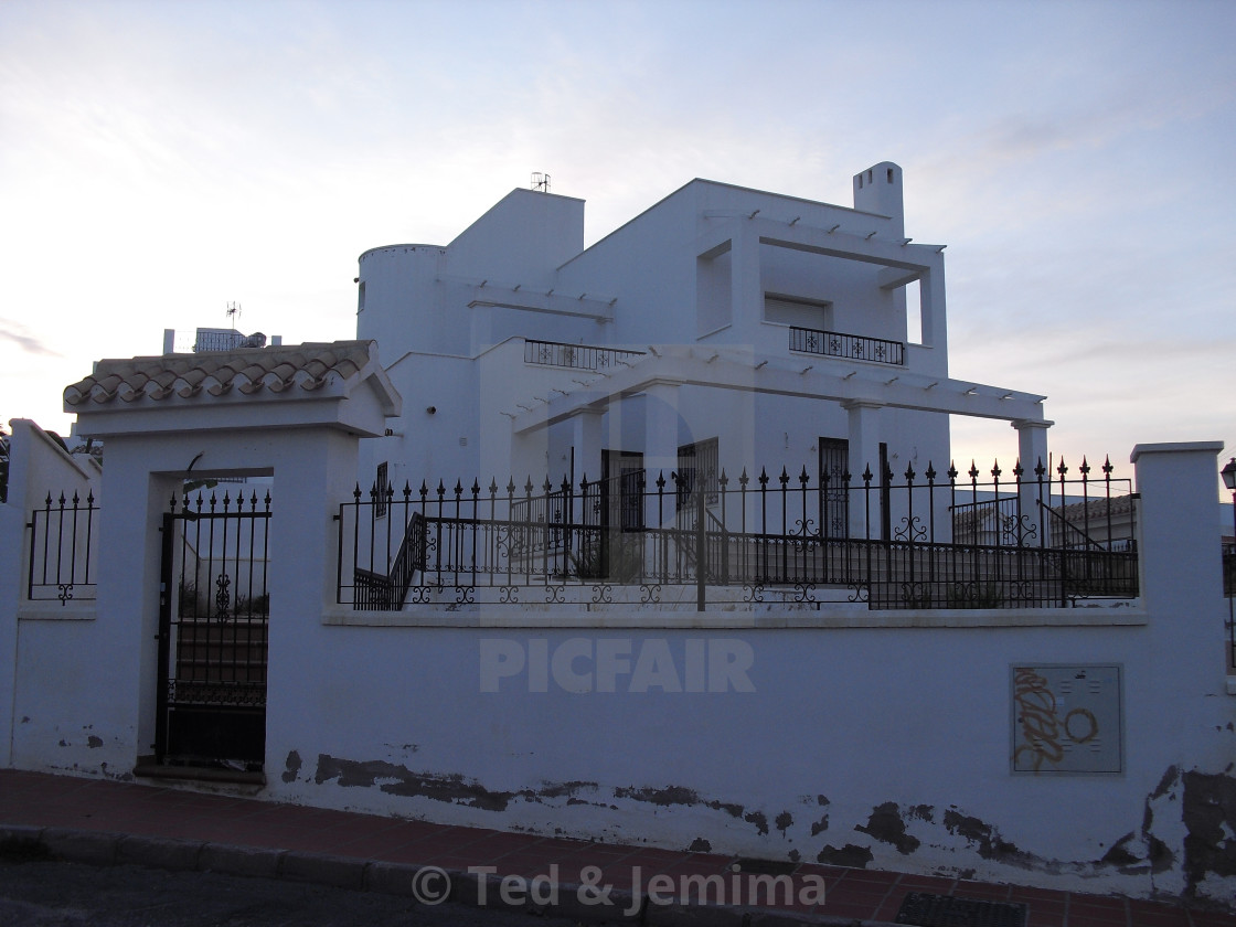 "Exterior of whitewash building at dusk showing flood damage on front wall, Mojacar Playa, Almeria, Andalusia, Spain" by Ted & Jemima - $5.06 "Exterior of whitewash building at dusk showing flood damage on front wall, Mojacar Playa, Almeria, Andalusia, Spain" stock image