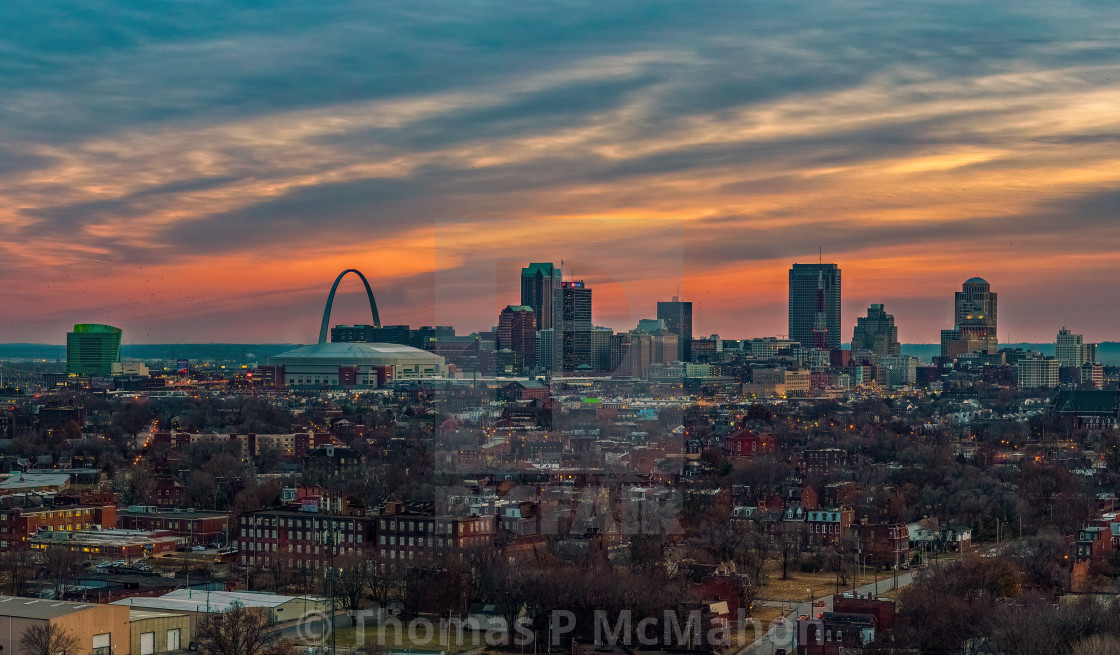 "As the sun sets over downtown St Louis, the skyline can be seen in the distance" stock image