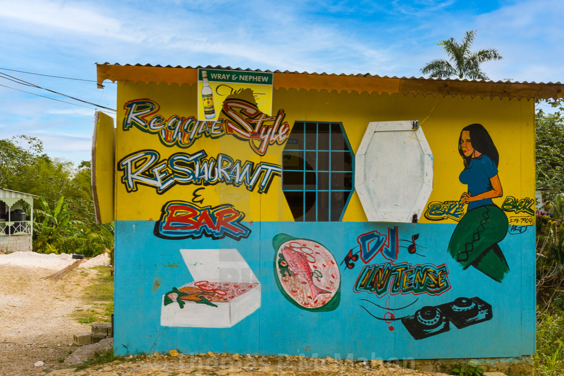 "The restaurant and bar can be found along the roadside in Jamaica and it serves Jamaican food" stock image