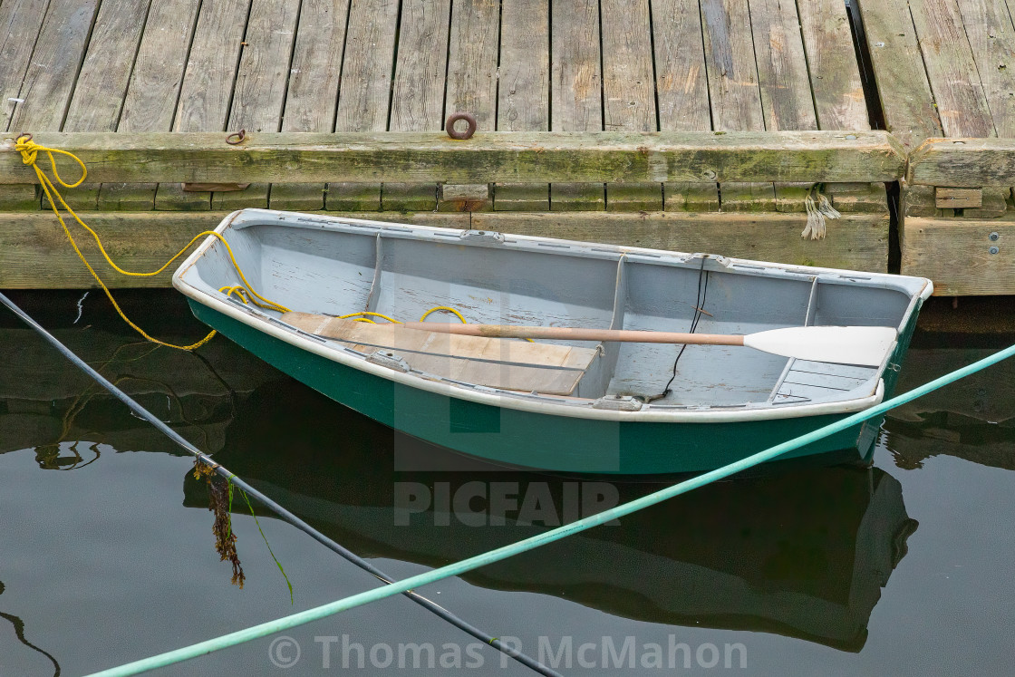 "Rowboat at dock | reflection" stock image