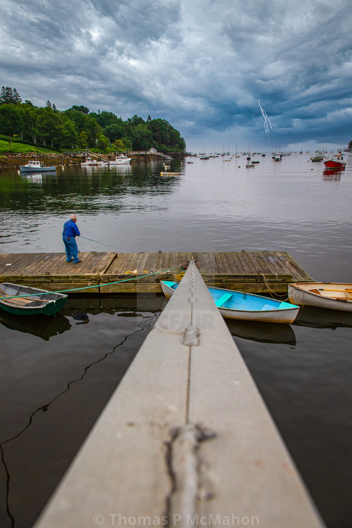 "Fishing off the dock in a storm with lighting" stock image