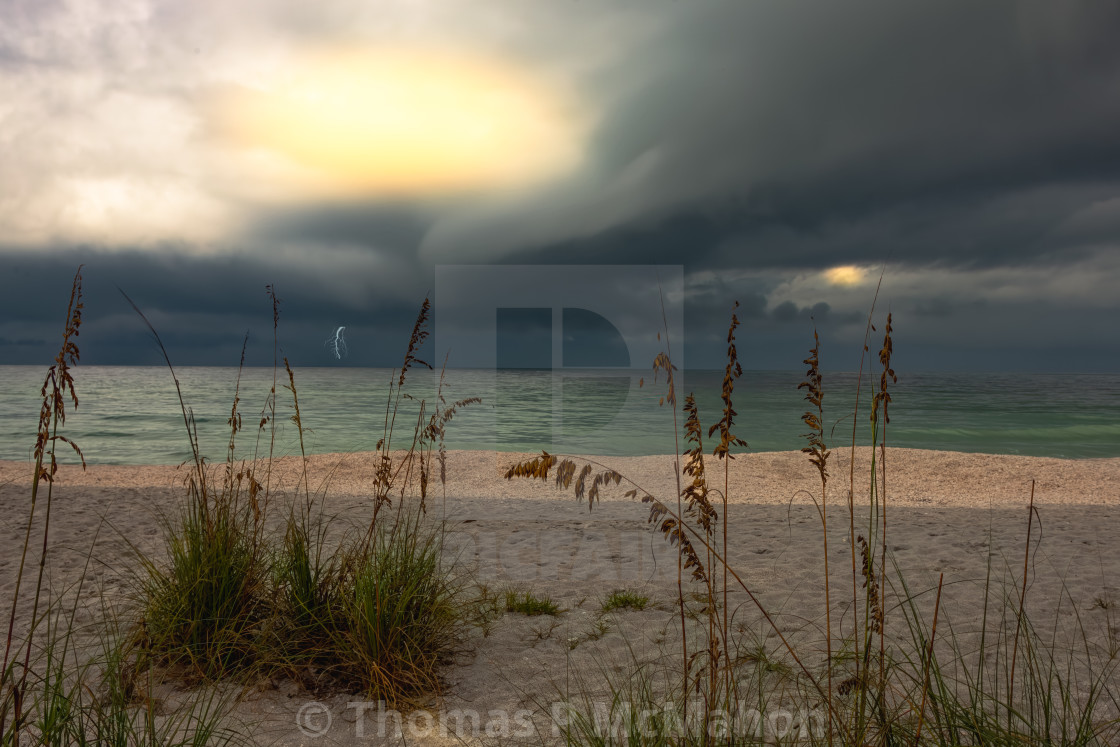 "An image of a storm on the beach during a storm" stock image