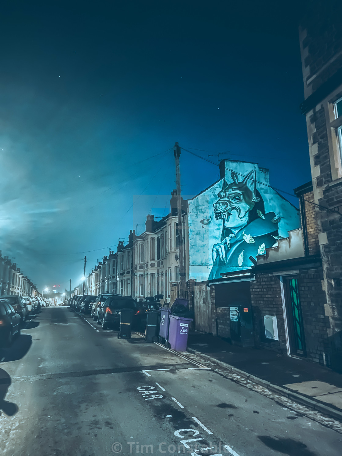 "Eerie street art at night" stock image