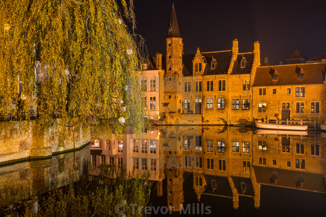 "Calm reflection at the Rozenhoedkaai in Bruges, Belgium" stock image