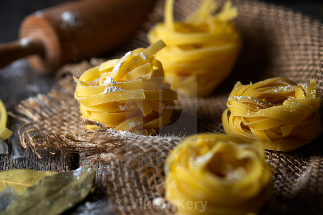 "Tagliatelle pasta and bay leaves" by Viktor Kery - $22.96 "Tagliatelle pasta and bay leaves" stock image