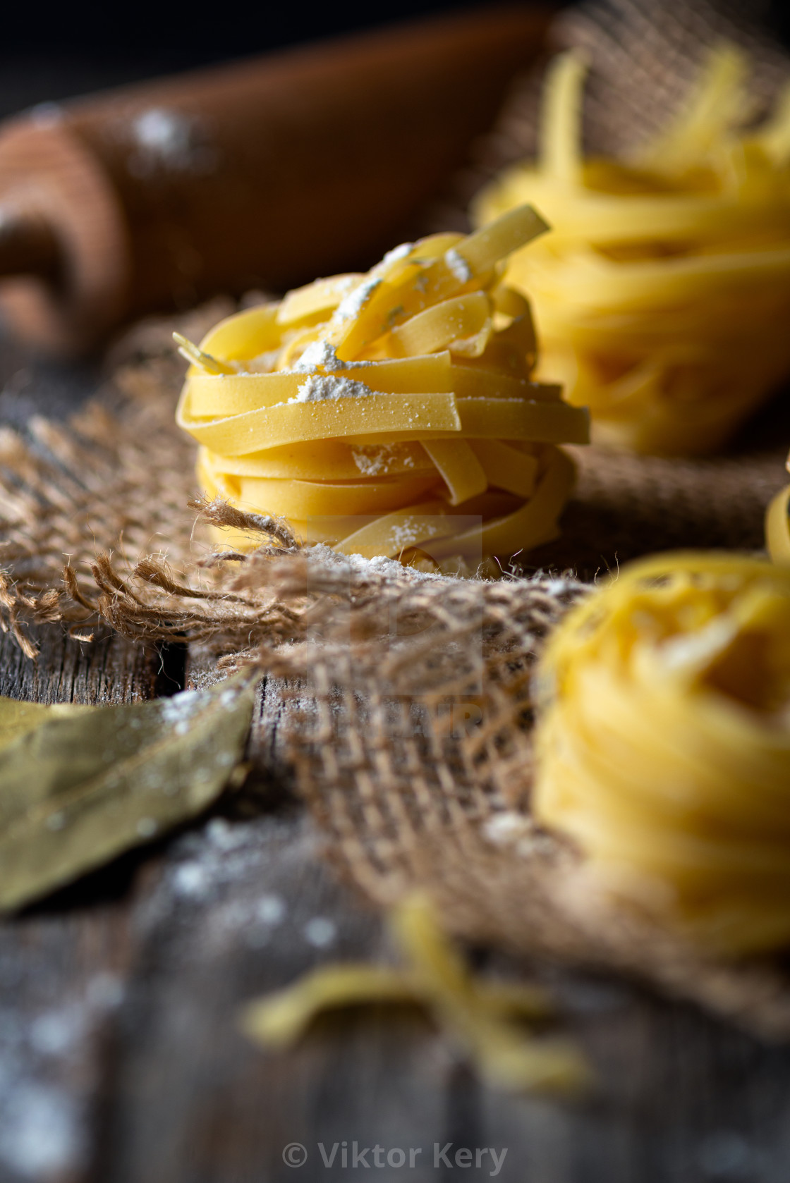 "Tagliatelle pasta and bay leaves" by Viktor Kery - $22.96 "Tagliatelle pasta and bay leaves" stock image