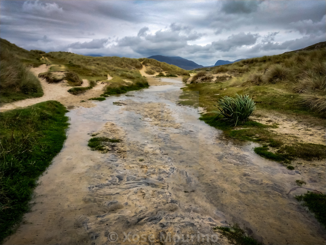 "Stream through the dunes." stock image