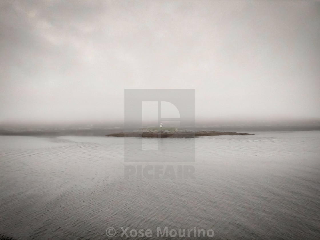 "Lighthouse in the fog, Isle of Harris." stock image